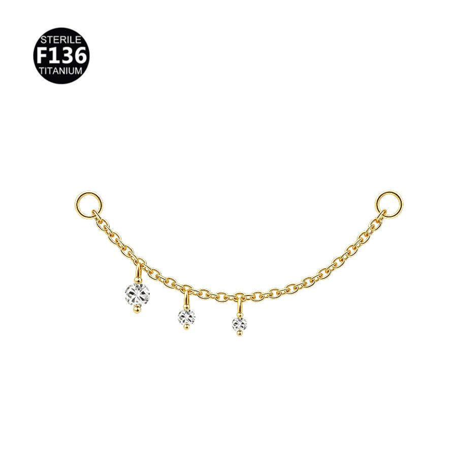 Sterile F136 titanium chain nose stud with three dangling clear gemstone charms, shown on a plain white background with a black circular F136 Titanium badge in the top-left corner.