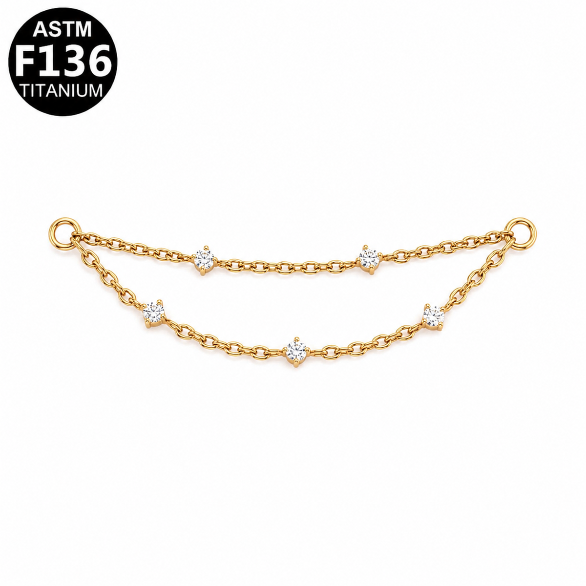 A gold-toned double-chain bracelet with small solitaire, star-shaped clear gemstone accents, shown on a white background with an ASTM F136 Titanium badge in the top-left corner.