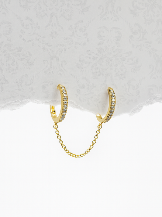 Gold hoop earrings with a chain 